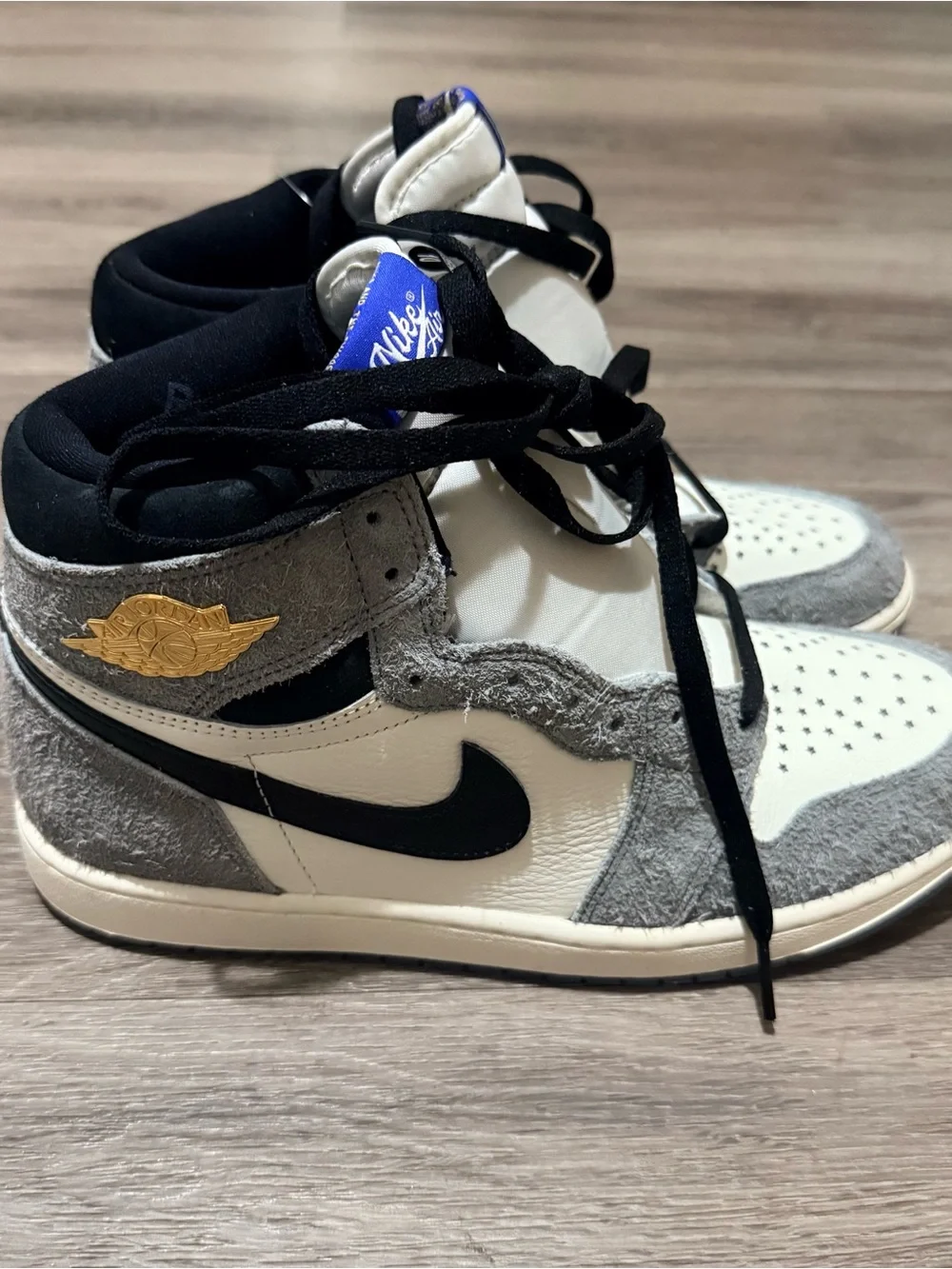 Jordan’s  Gray and White High Top Sneakers